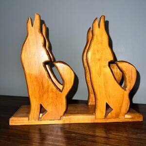 Wood carved howling coyotes southwestern